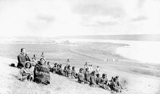 Students and staff of the Fort Qu'Appelle Indian Industrial School on a hillside above the lake